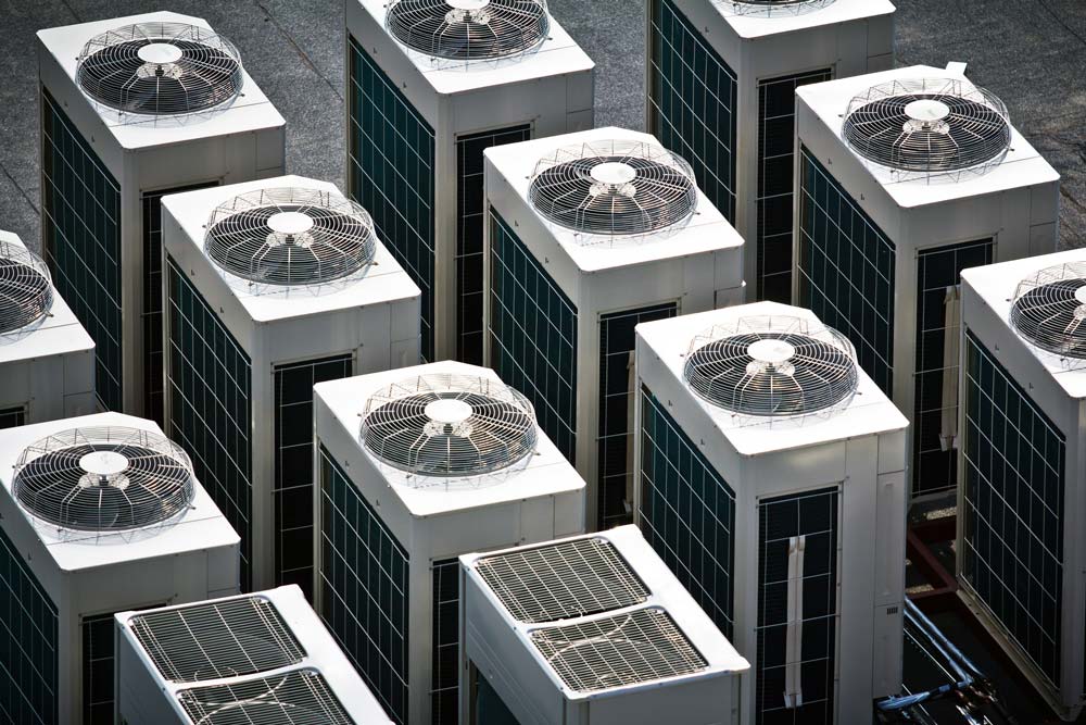 Commercial Air Conditioning units on top of a stone building